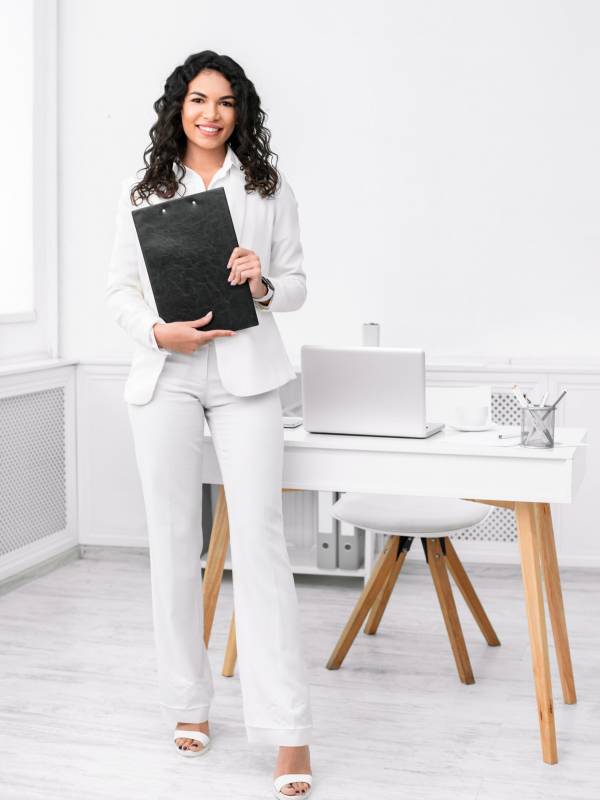 Full length image of latin woman with clipboard